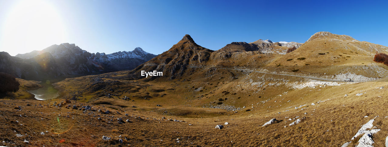 SCENIC VIEW OF MOUNTAINS AGAINST CLEAR BLUE SKY