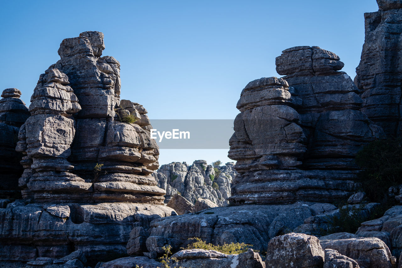 LOW ANGLE VIEW OF ROCK FORMATION AGAINST SKY