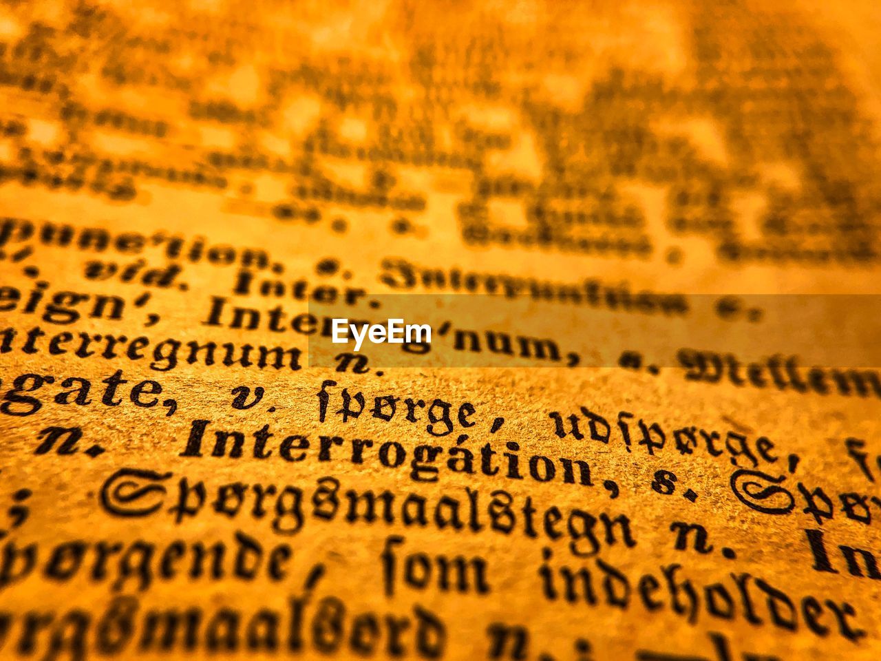 CLOSE-UP OF TEXT WRITTEN ON BOOK