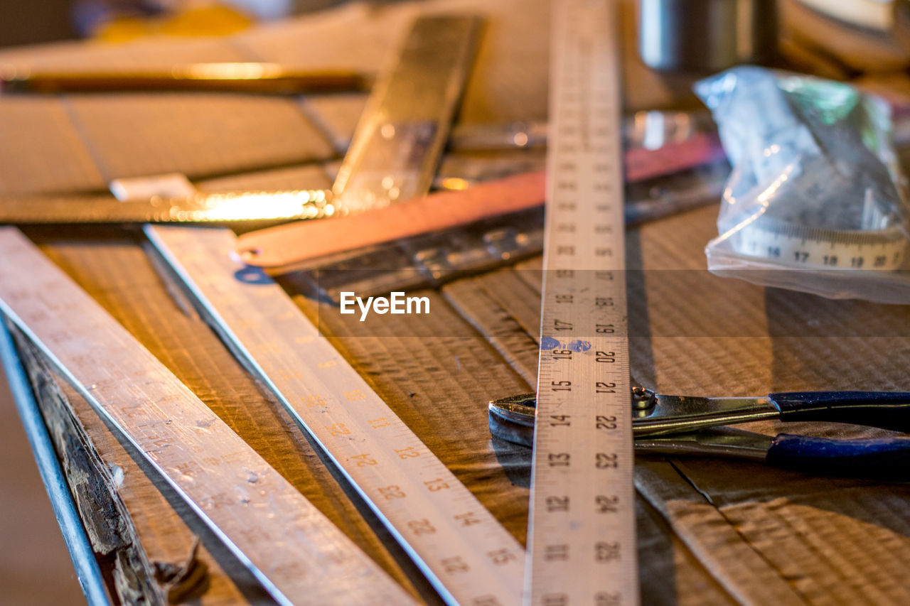 High angle view of tools and scale on table