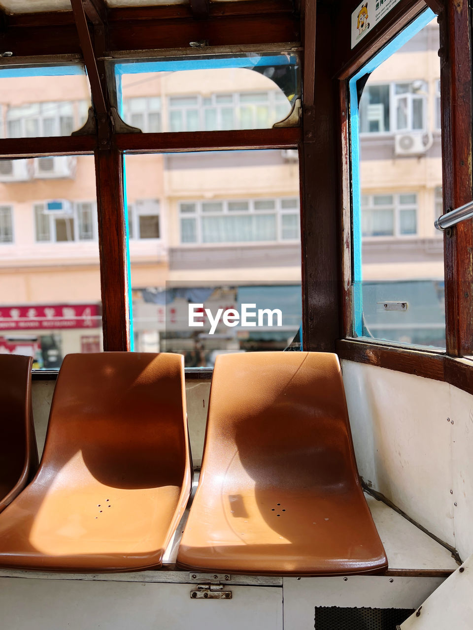 Empty seats on antique streetcar in hongkong 