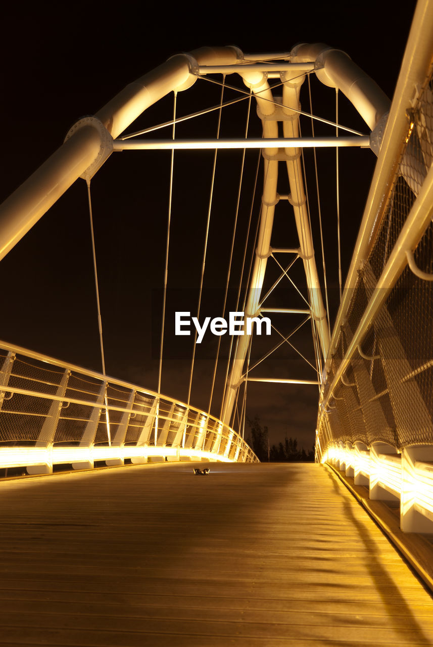 View of suspension bridge at night