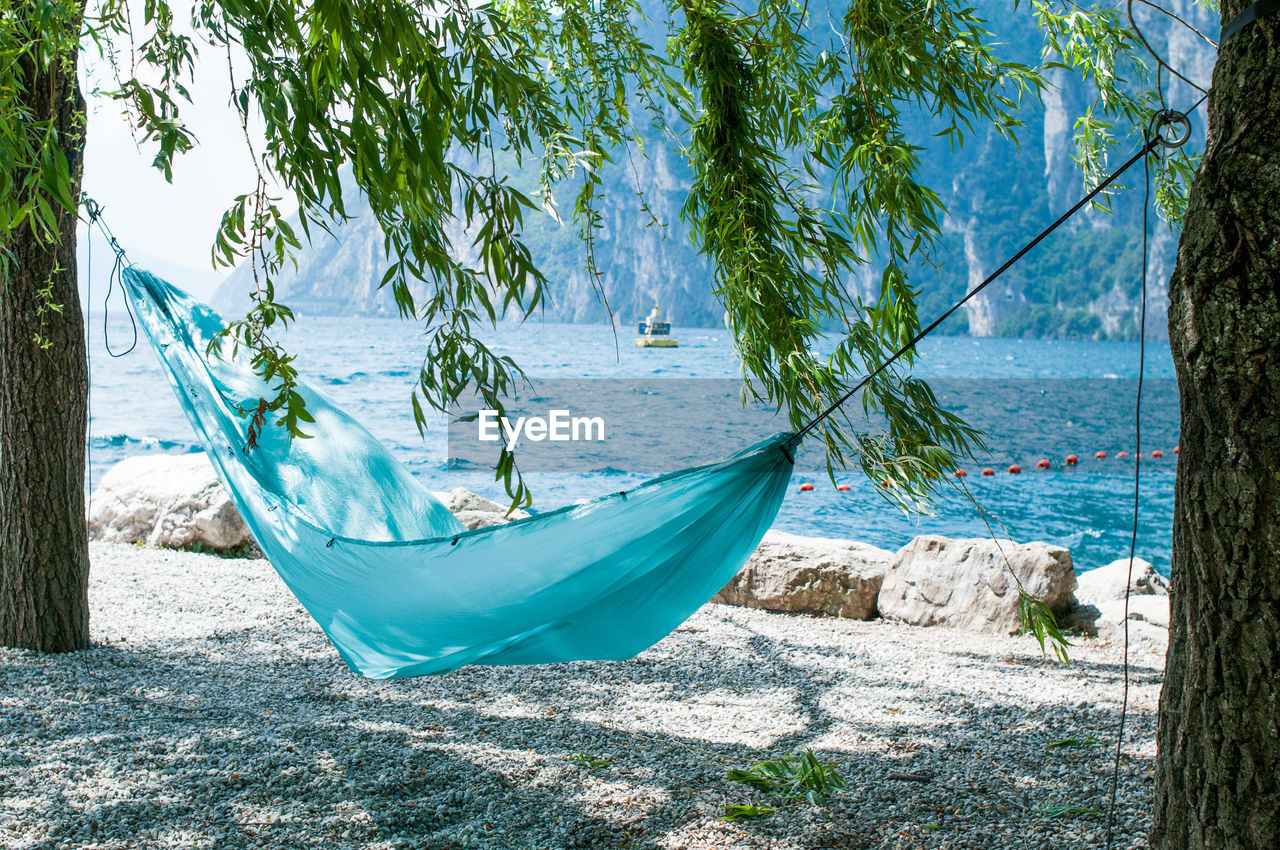 Blue hammock on lakeshore