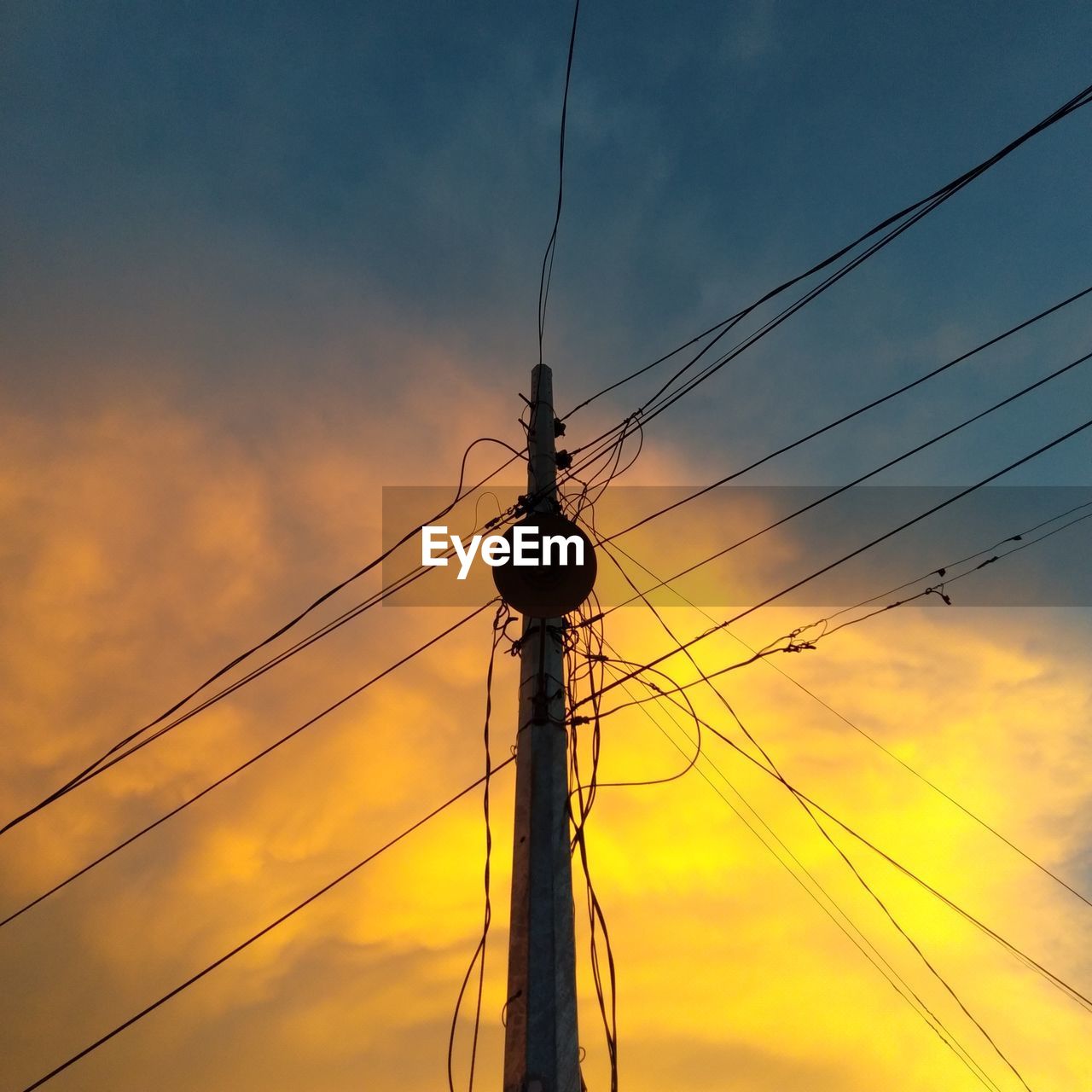 LOW ANGLE VIEW OF SILHOUETTE ELECTRICITY PYLON AGAINST SKY