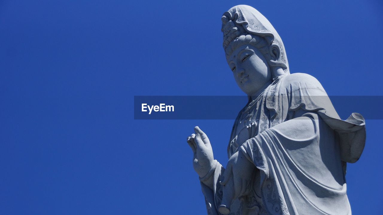 Low angle view of guanyin bodhisattva statue at nan hai pu tuo temple