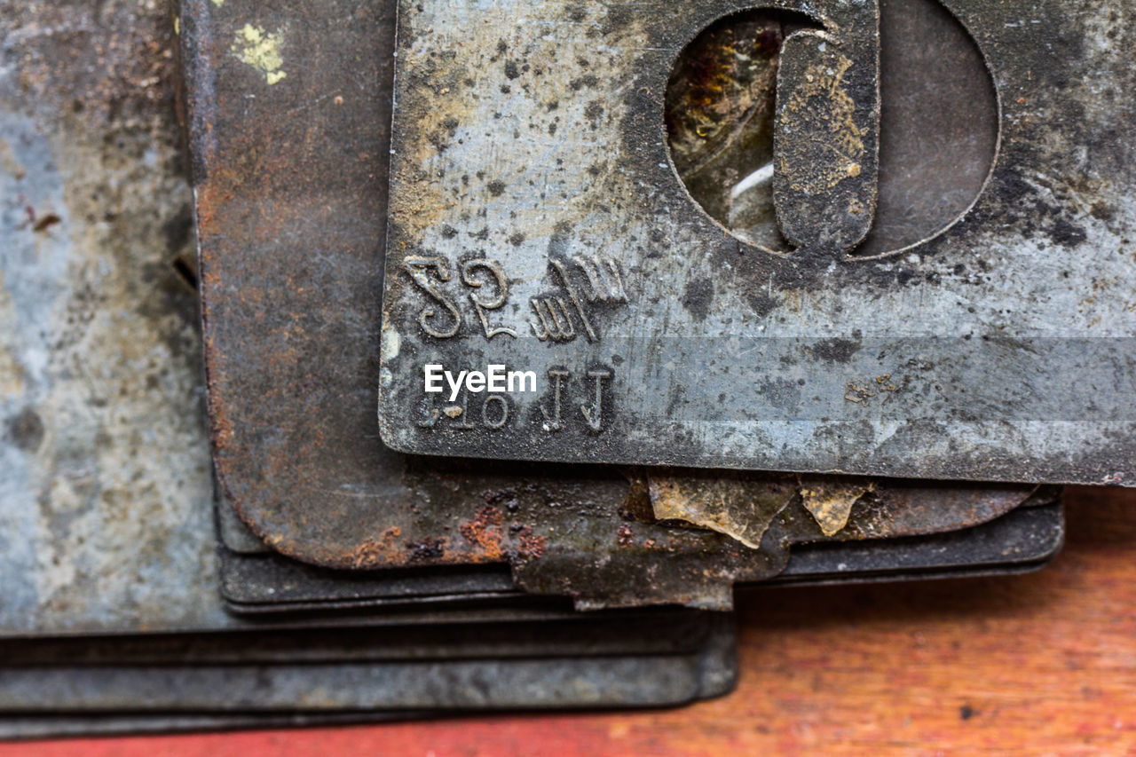 CLOSE-UP OF RUSTY ABANDONED