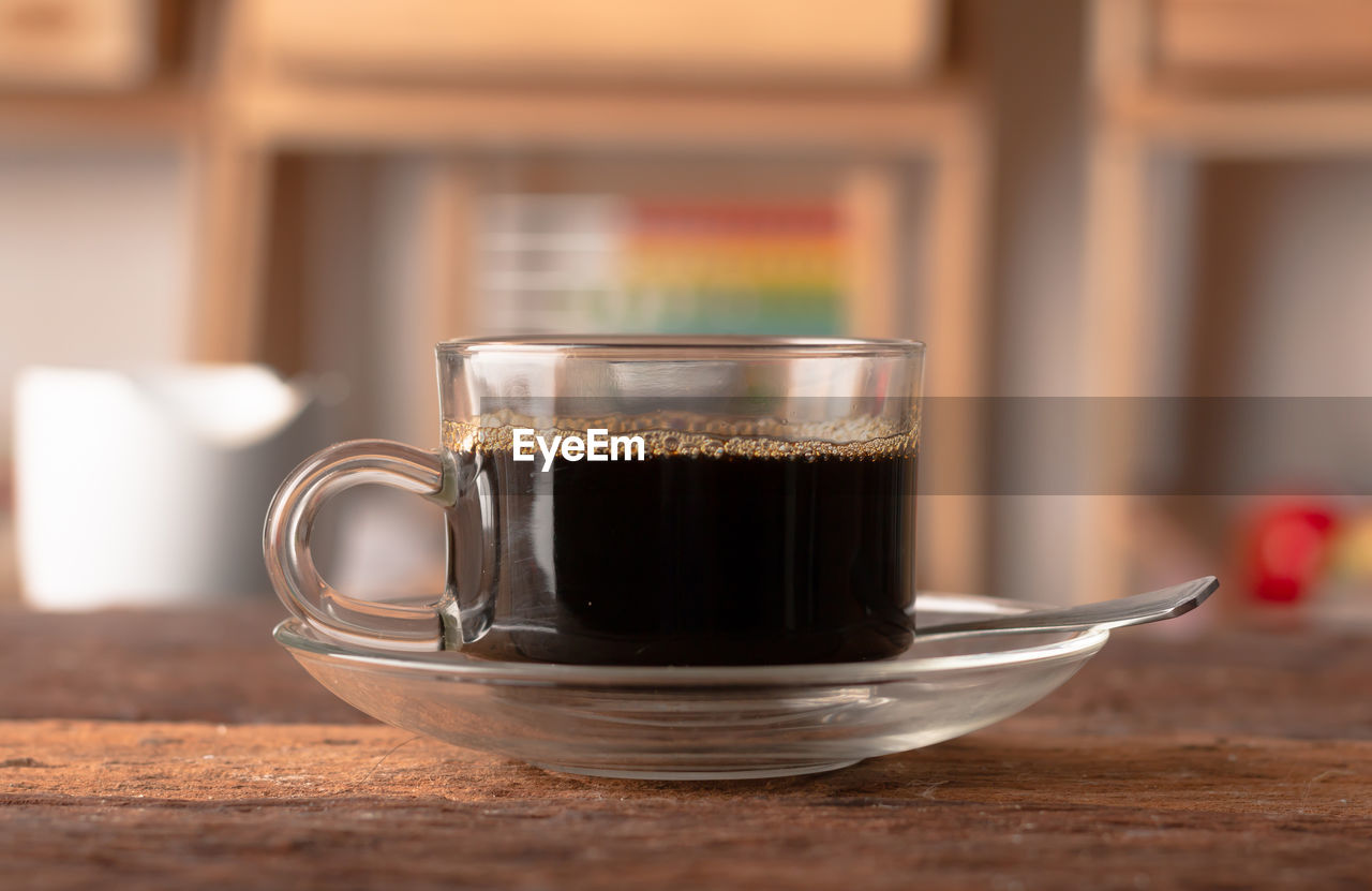 Close-up of coffee cup on table