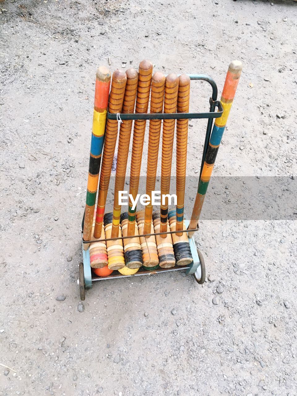 High angle view of croquet mallets on rack