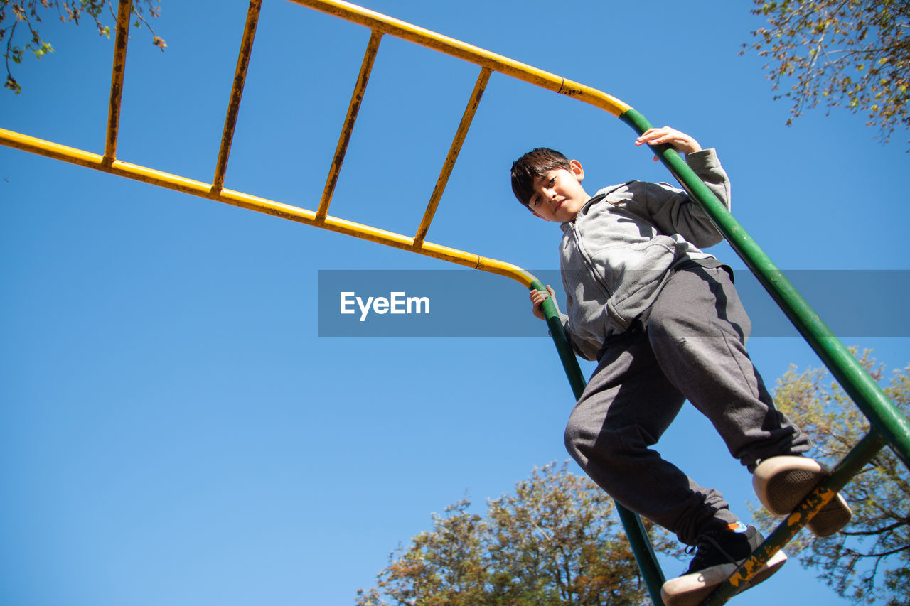 Portrait of boy playing in playground