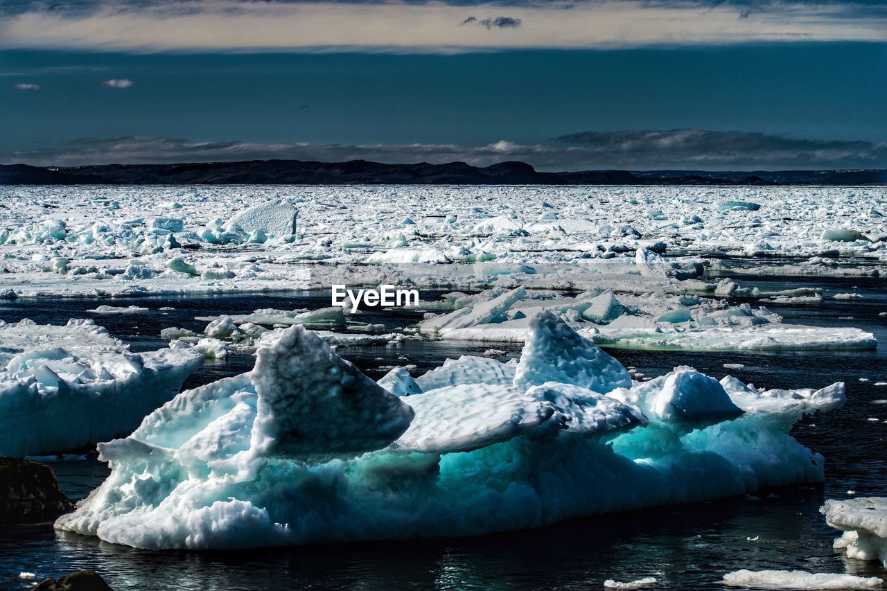 CLOSE-UP OF ICE FLOATING ON SEA