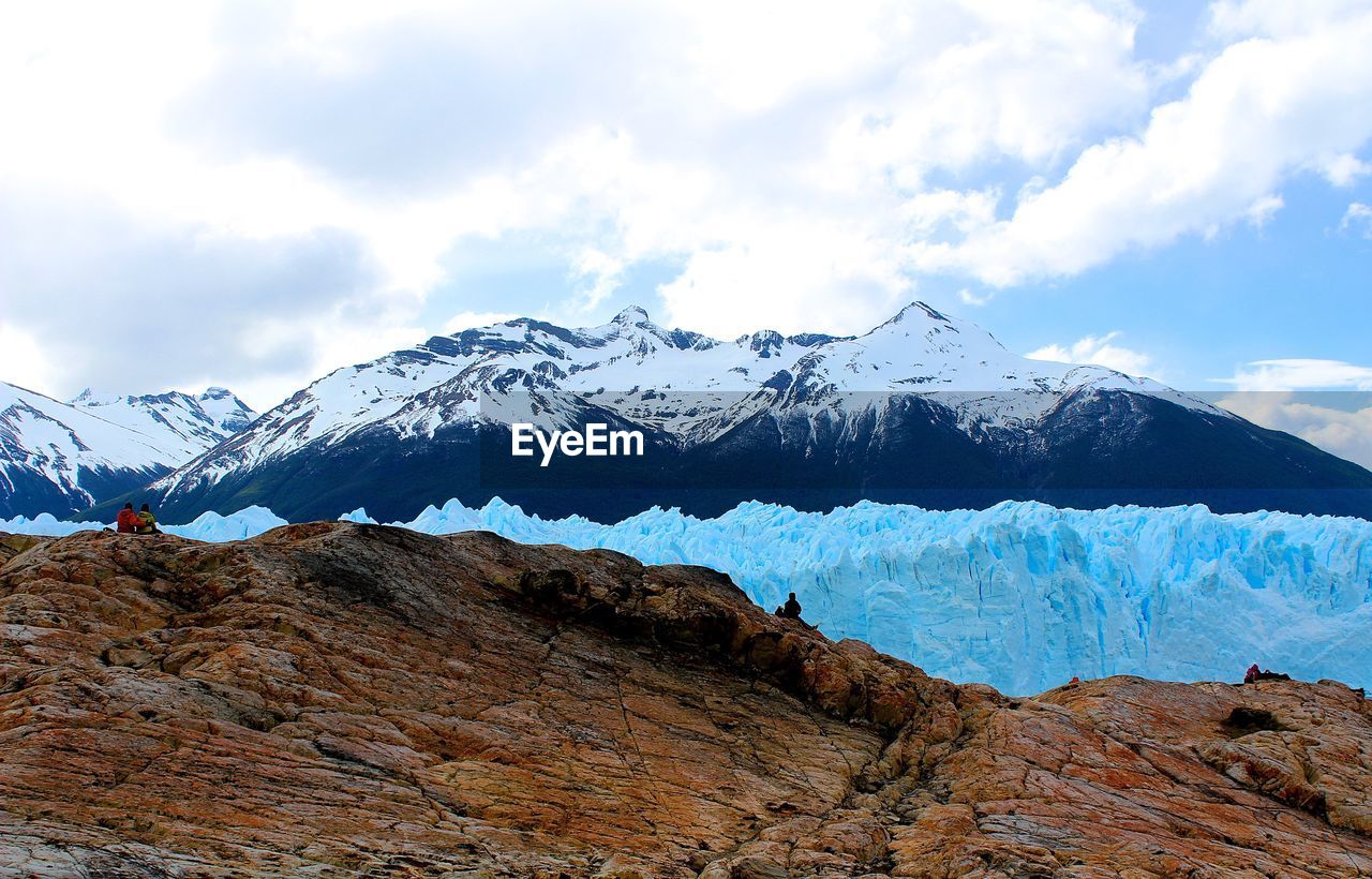 Scenic view of snowcapped mountains against cloudy sky at patagonia