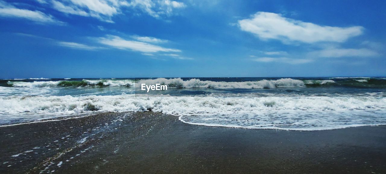 Scenic view of beach against sky