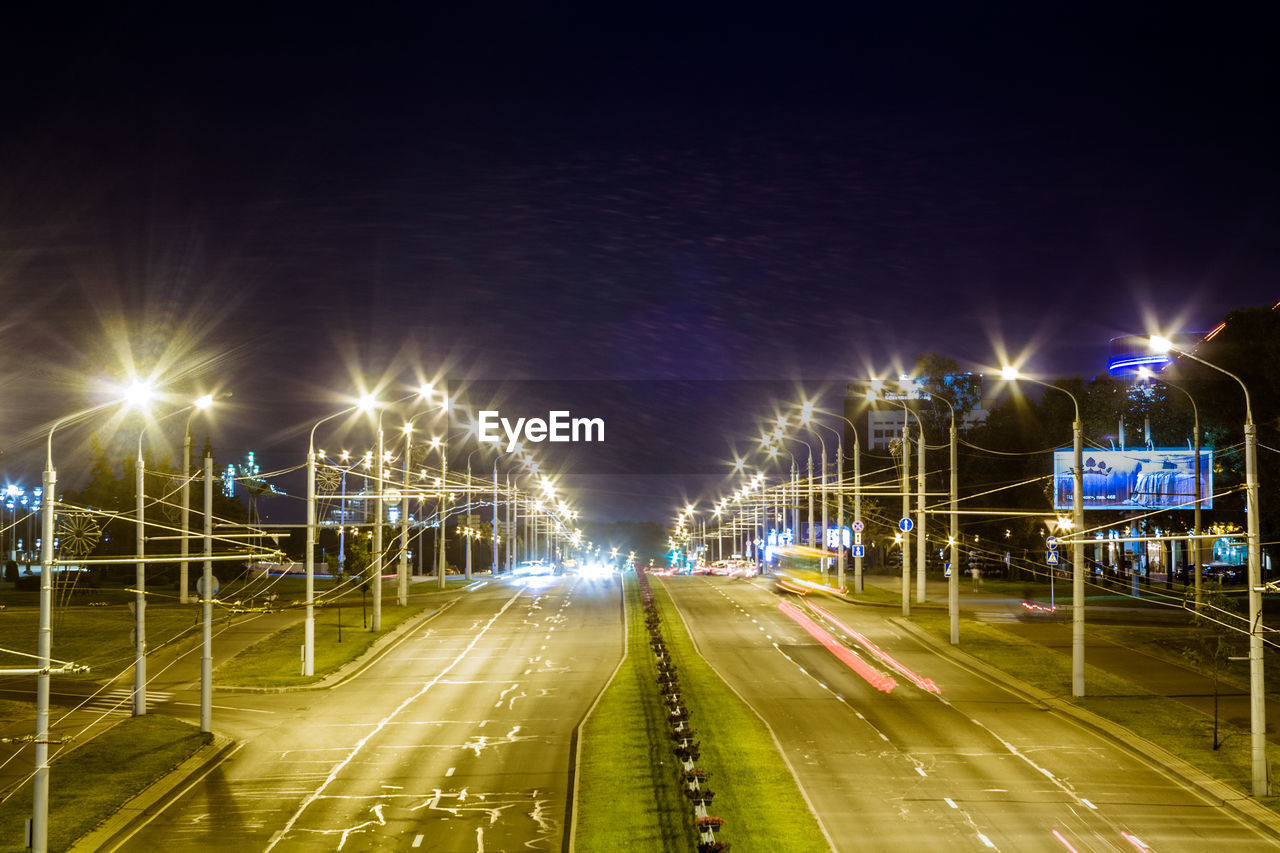 ILLUMINATED STREET AT NIGHT