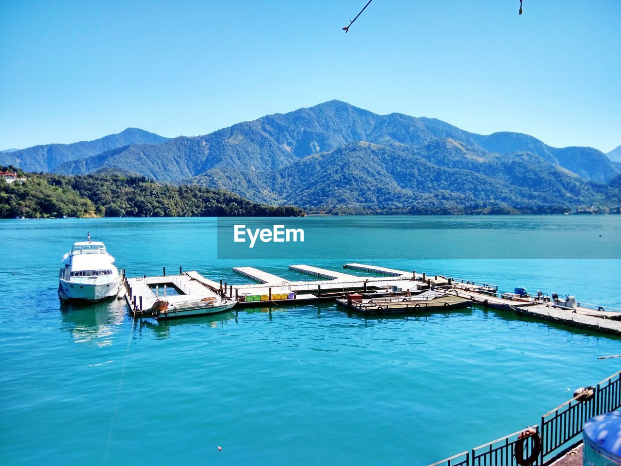 Scenic view of sea against clear blue sky