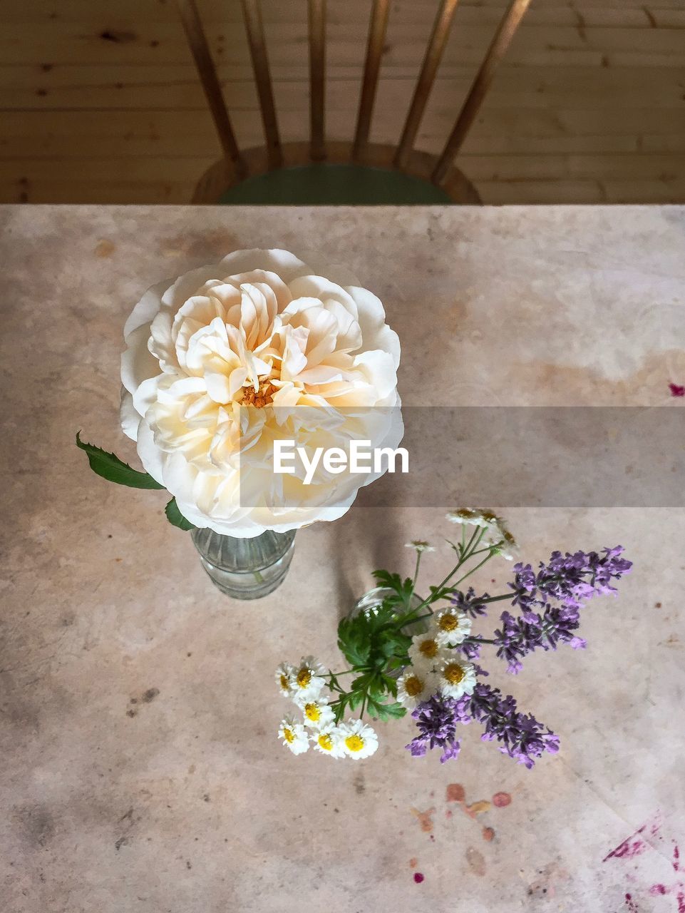 HIGH ANGLE VIEW OF BOUQUET ON WHITE TABLE