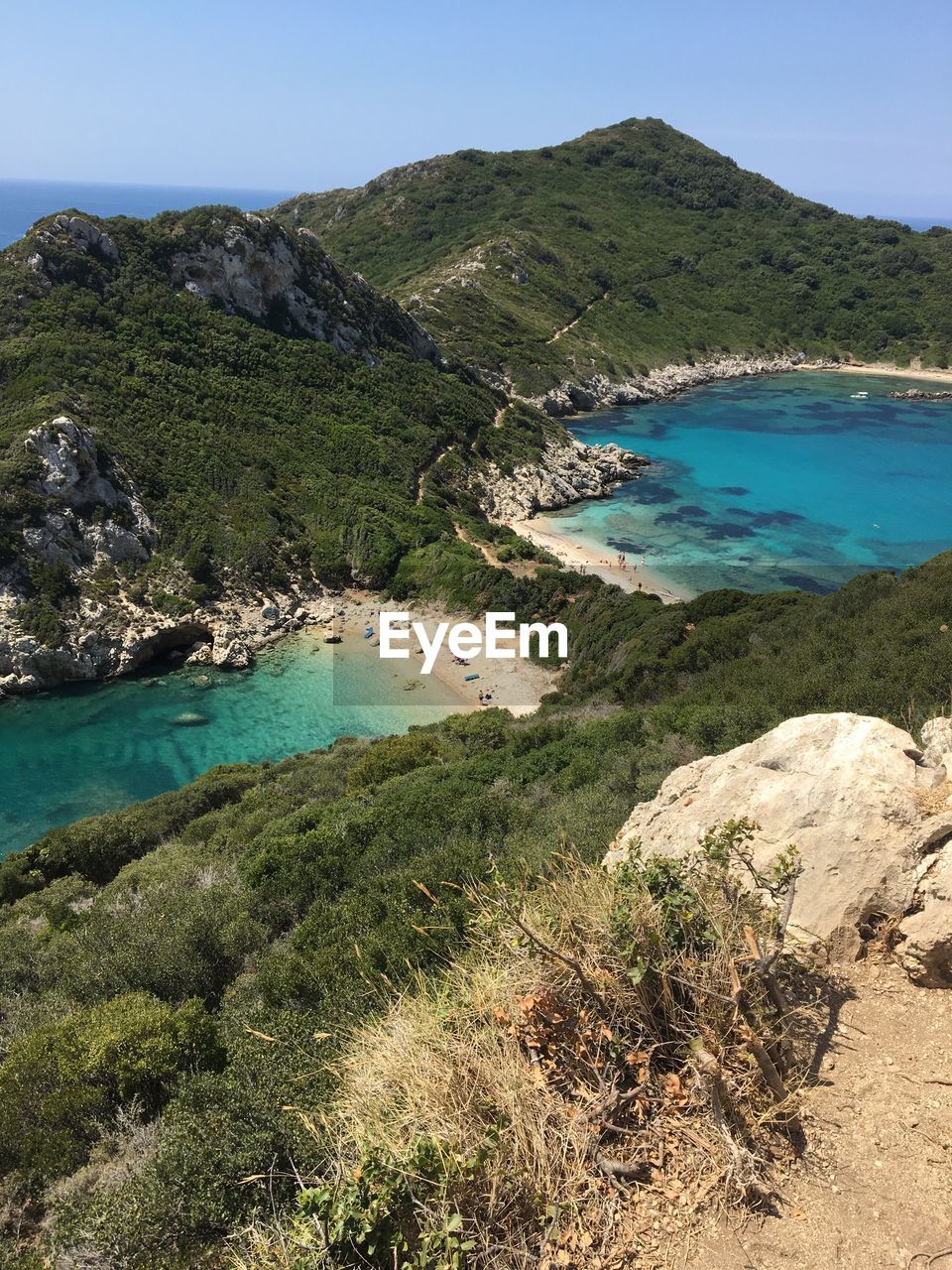 High angle view of blue turquoise sea against mountains