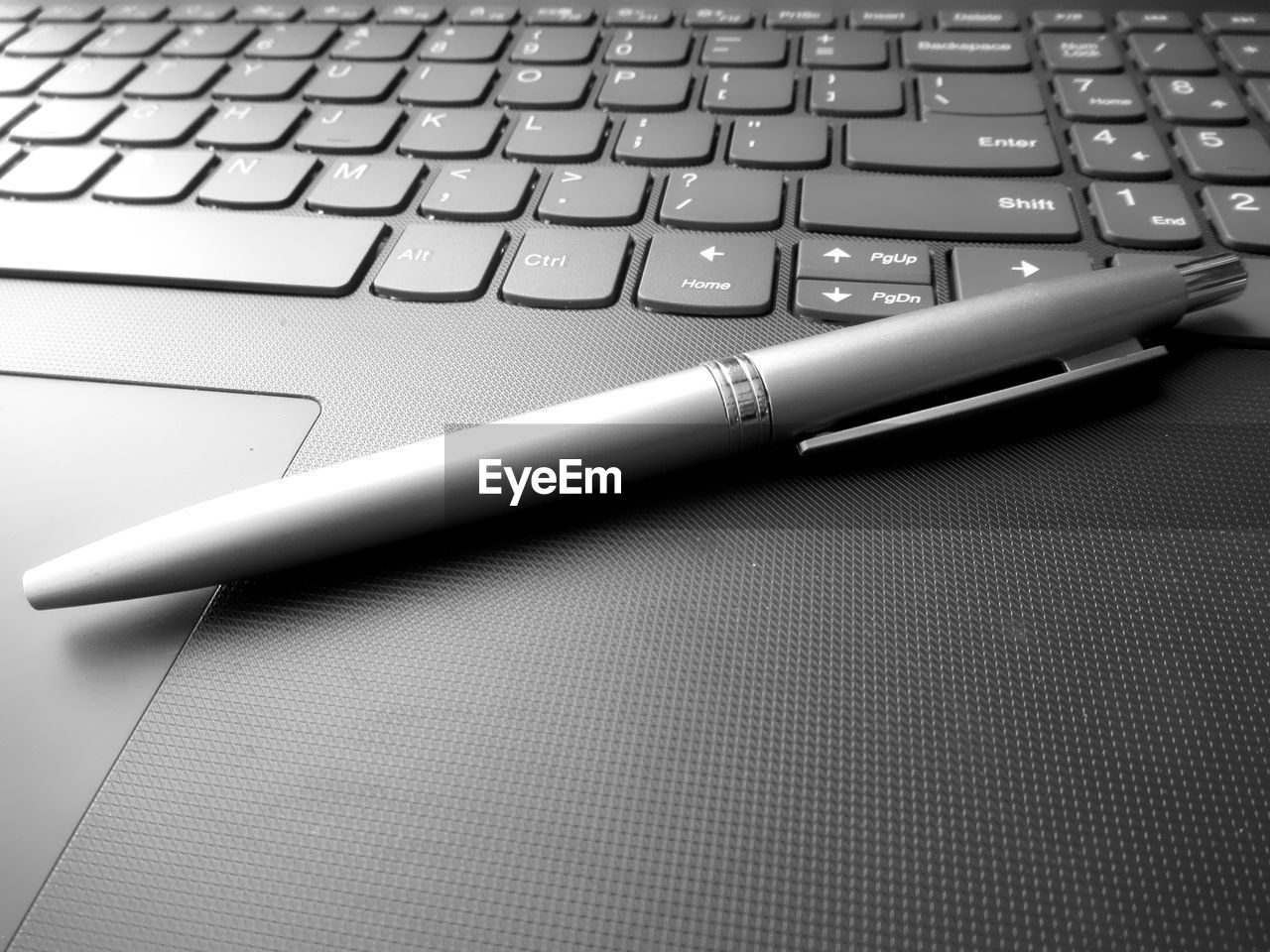 Close-up of pen on laptop