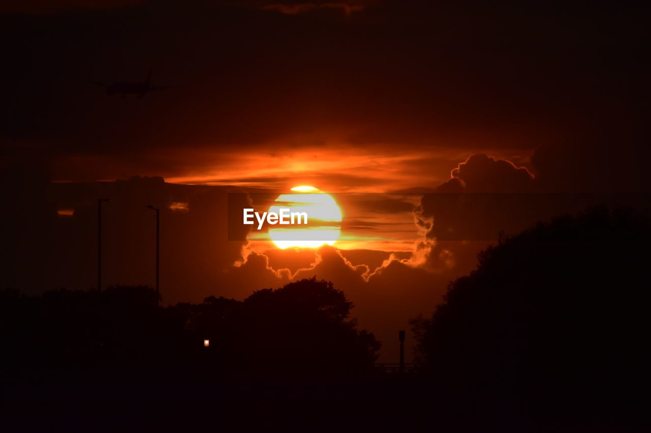 SCENIC VIEW OF SILHOUETTE TREES AGAINST ROMANTIC SKY AT SUNSET