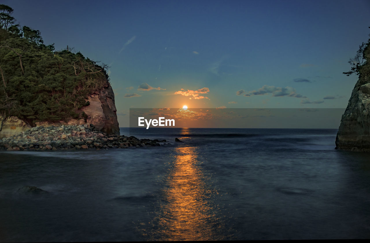 Scenic view of sea against sky during sunset
