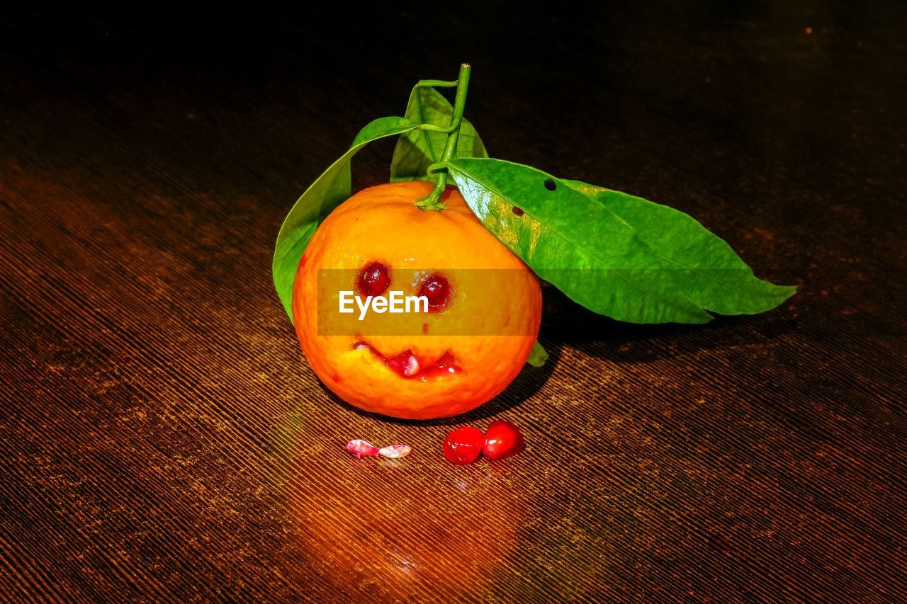 HIGH ANGLE VIEW OF FRUITS ON TABLE AGAINST BLACK BACKGROUND