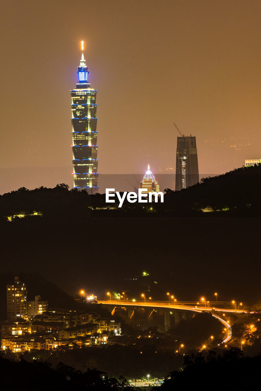 Illuminated buildings in city at night
