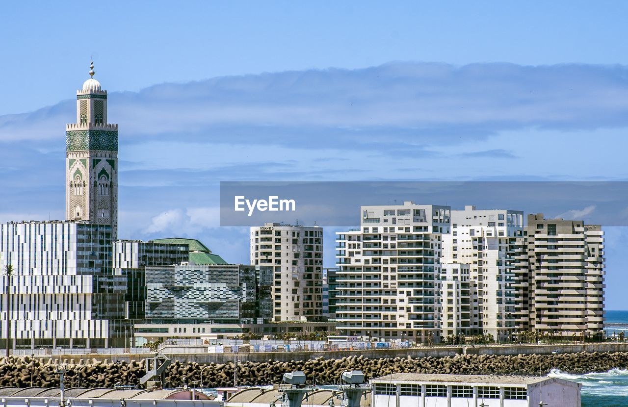 Modern buildings in city against sky