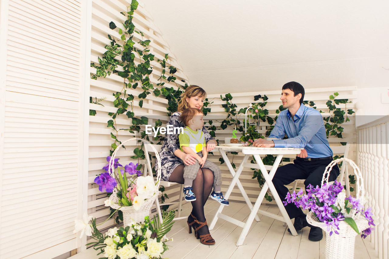 PEOPLE ON POTTED PLANT