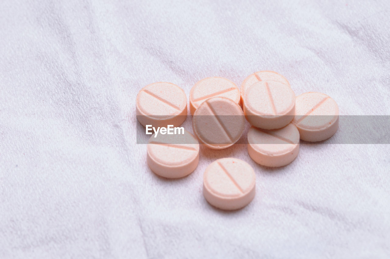 Group of pink tablet of medicine, studio shot