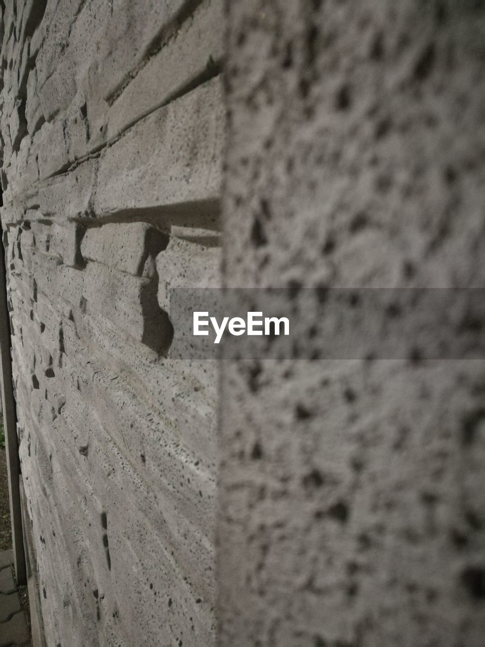 LOW ANGLE VIEW OF A WALL WITH SHADOW