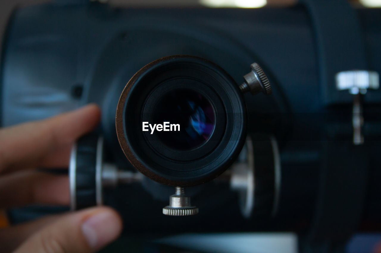 Close-up of hand holding camera