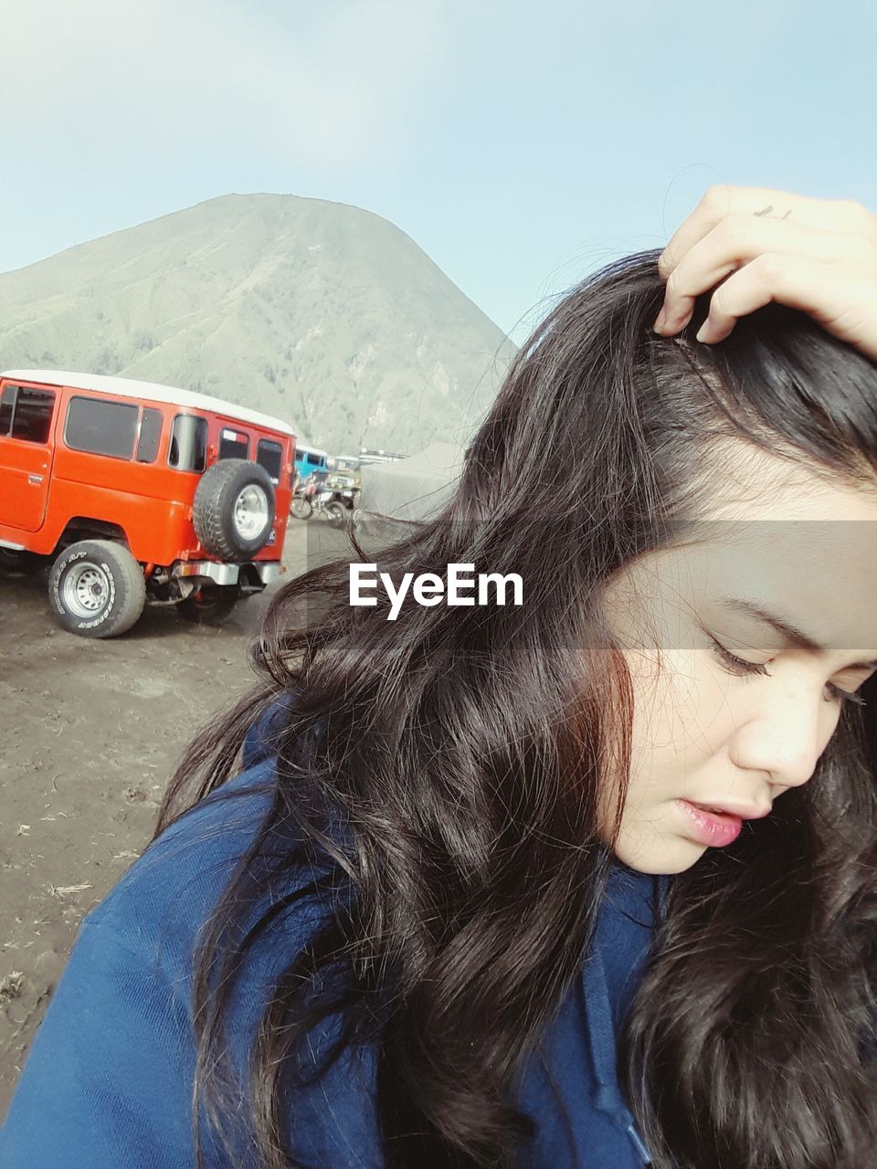 WOMAN LOOKING AT VIEW OF TRAIN