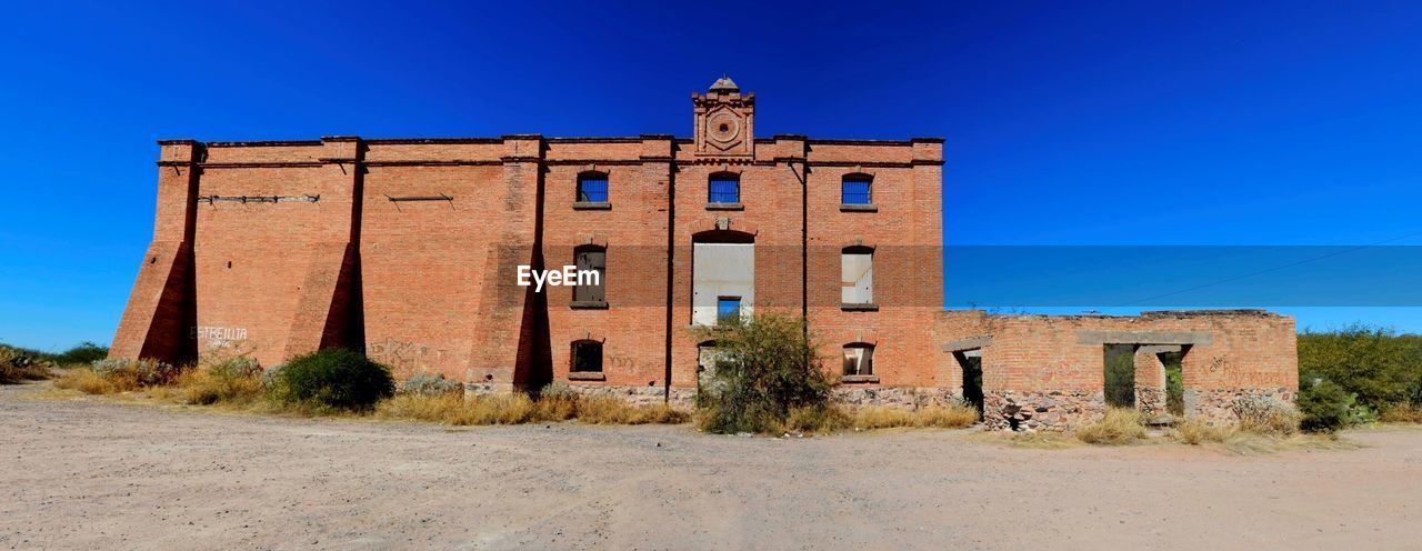 Old building against blue sky