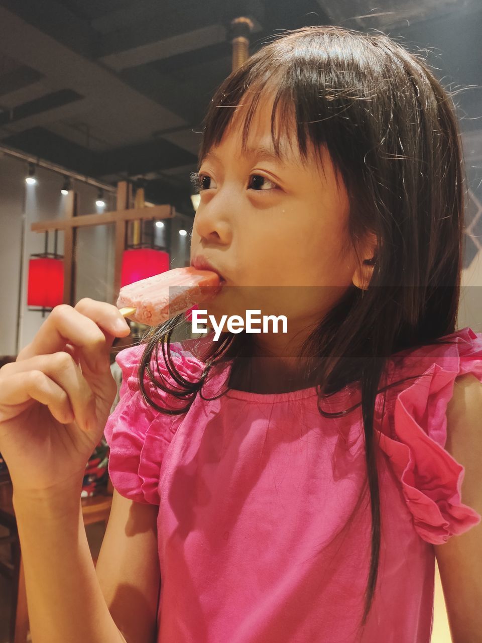 Close-up of girl blowing bubbles