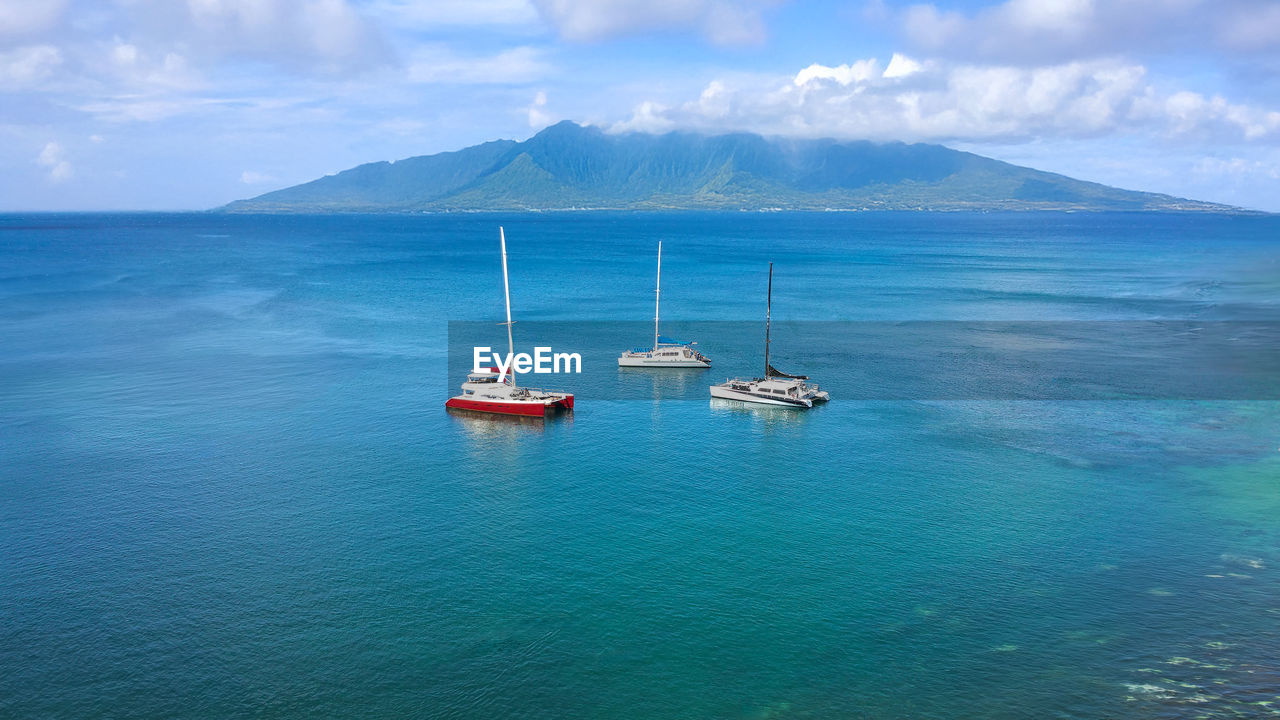 water, sea, nautical vessel, transportation, scenics - nature, mode of transportation, sky, beauty in nature, cloud, travel, nature, horizon, land, mountain, blue, travel destinations, tranquility, ship, ocean, no people, sailboat, tranquil scene, landscape, environment, day, beach, vehicle, sailing, bay, outdoors, idyllic, coast, island, tourism, yacht, holiday, vacation, non-urban scene, trip, seascape, boat, shore, sailing ship, summer, coastline