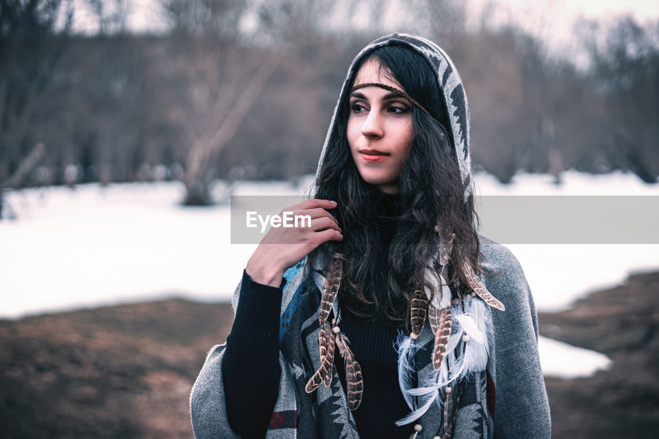 Portrait of beautiful young woman in winter