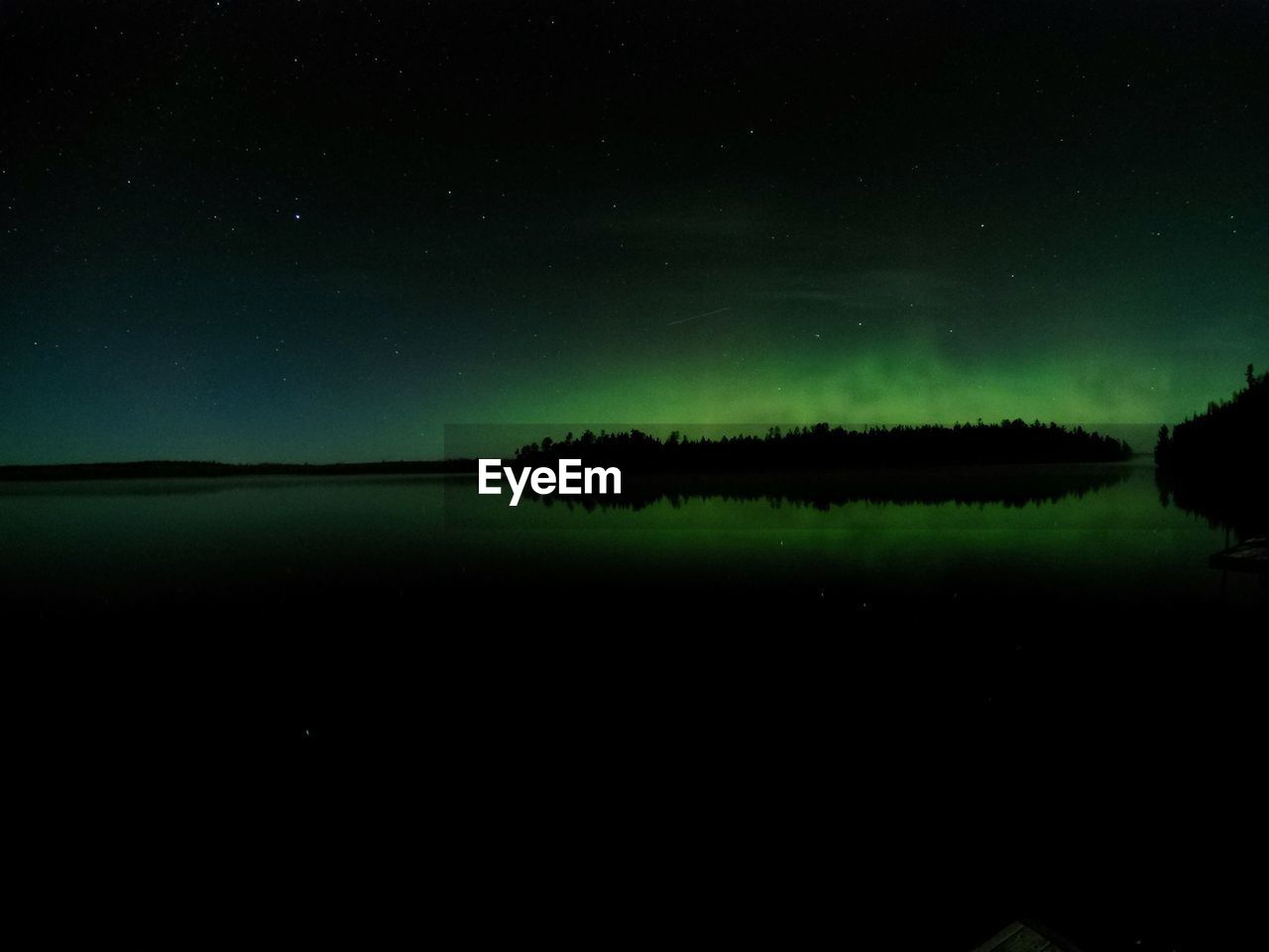 SCENIC VIEW OF LAKE AGAINST STAR FIELD