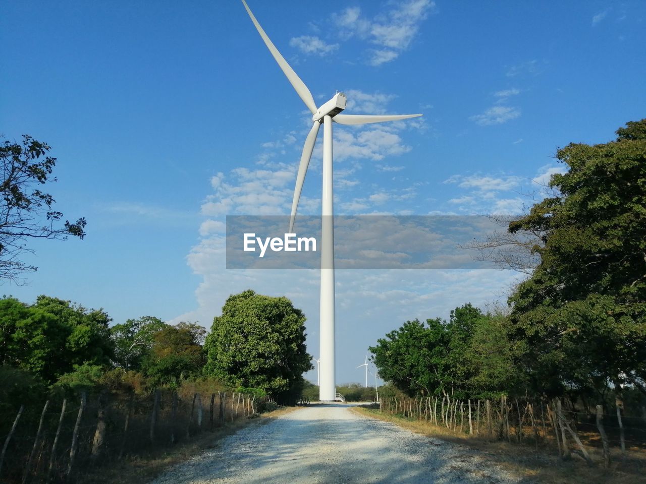 LOW ANGLE VIEW OF WIND TURBINES AGAINST SKY