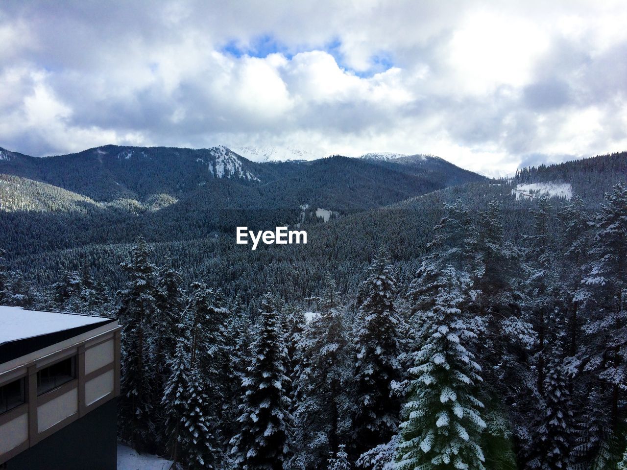 Scenic view of mountains against sky during winter