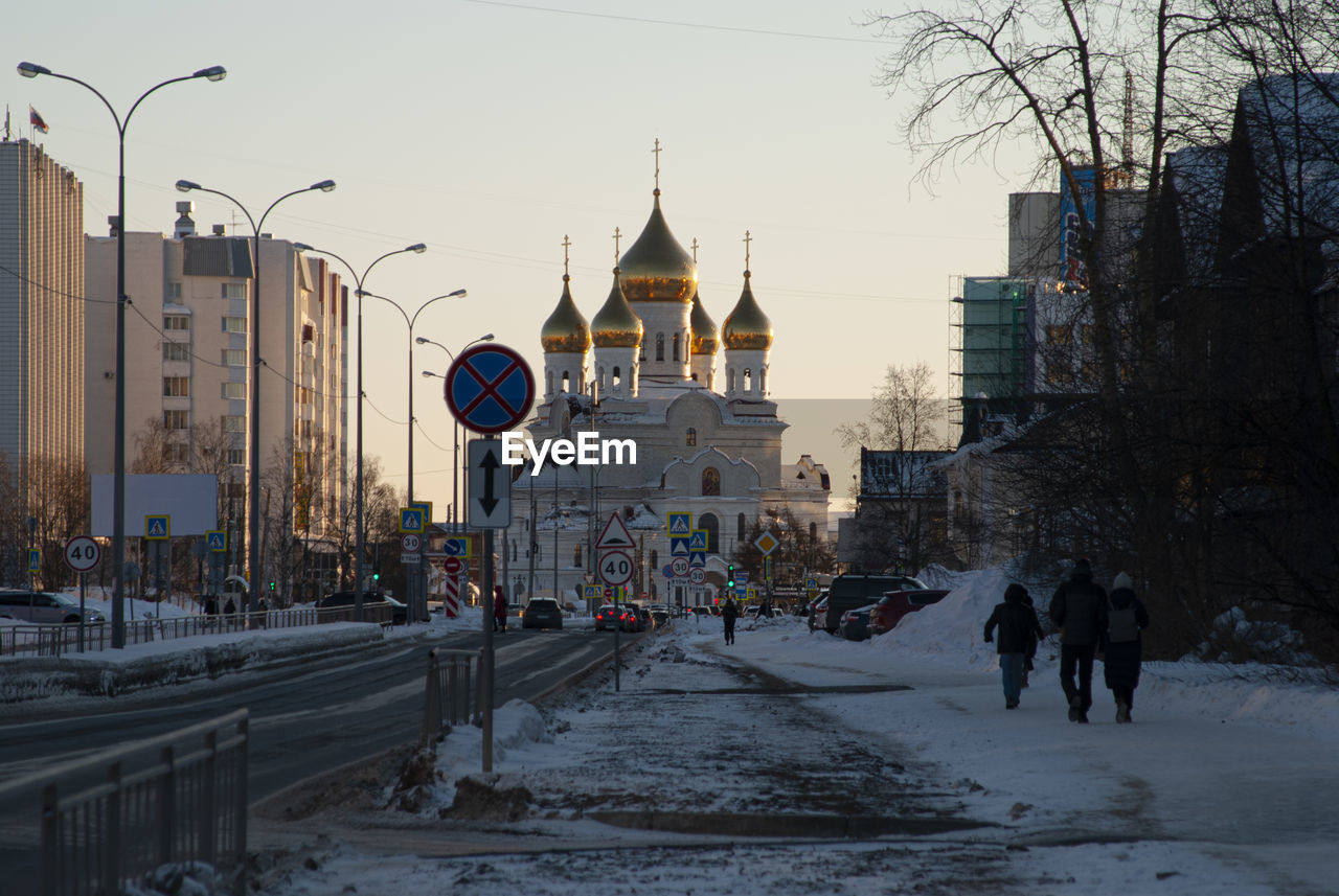 The street leading to the cathedral in a contrasting warm sky with gilded domes