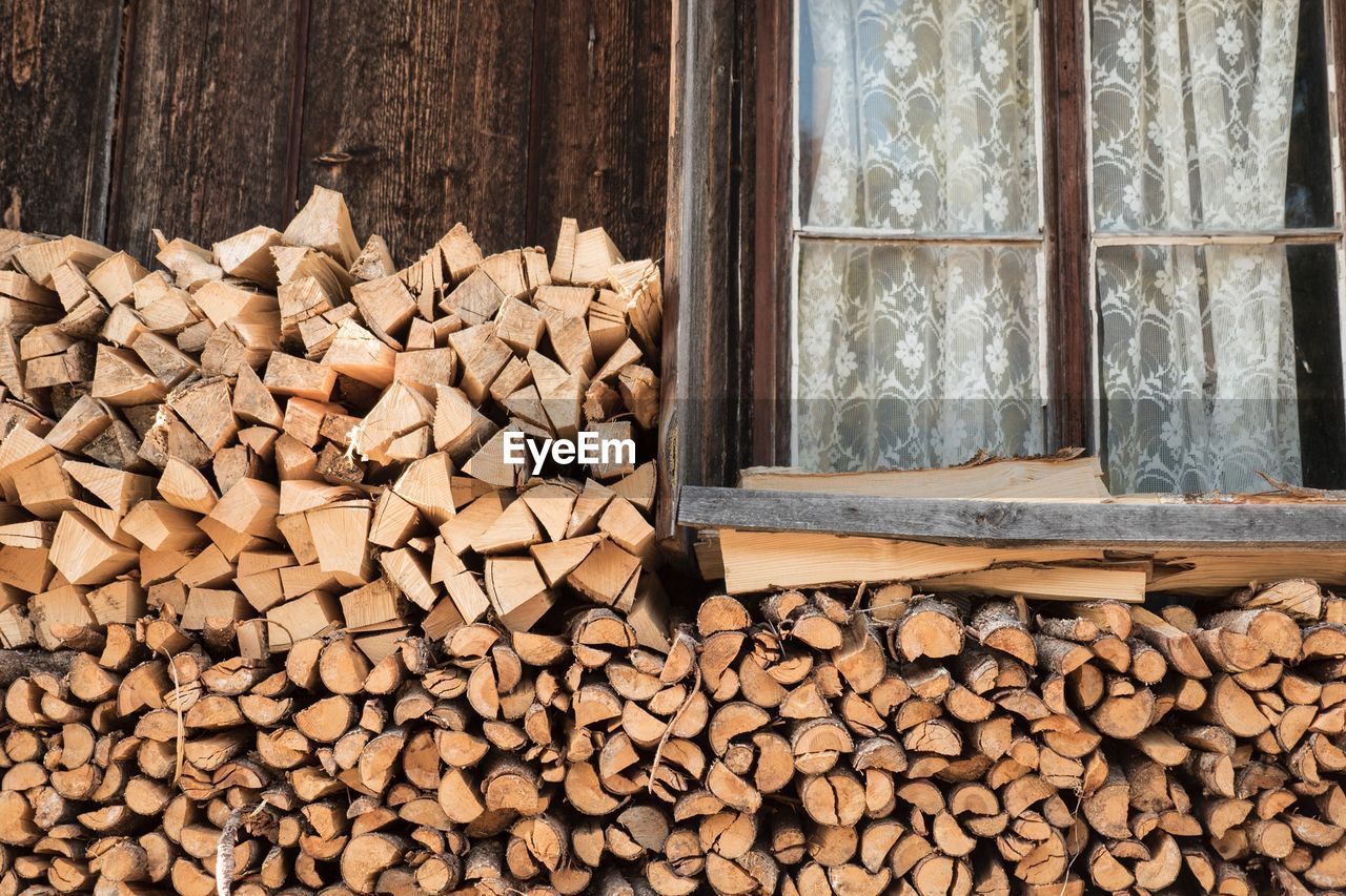 Heap of firewood by window