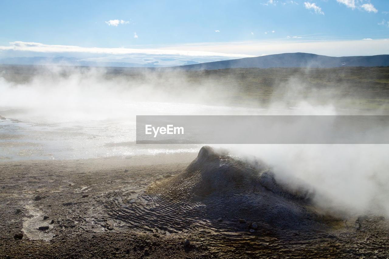 Scenic view of volcanic landscape against sky