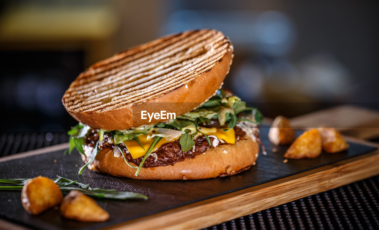 close-up of burger on cutting board