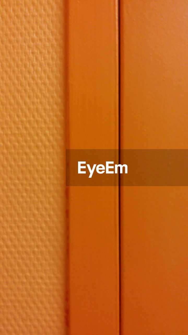 Cropped shot of orange door
