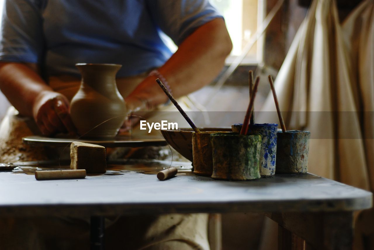 Artist making pottery