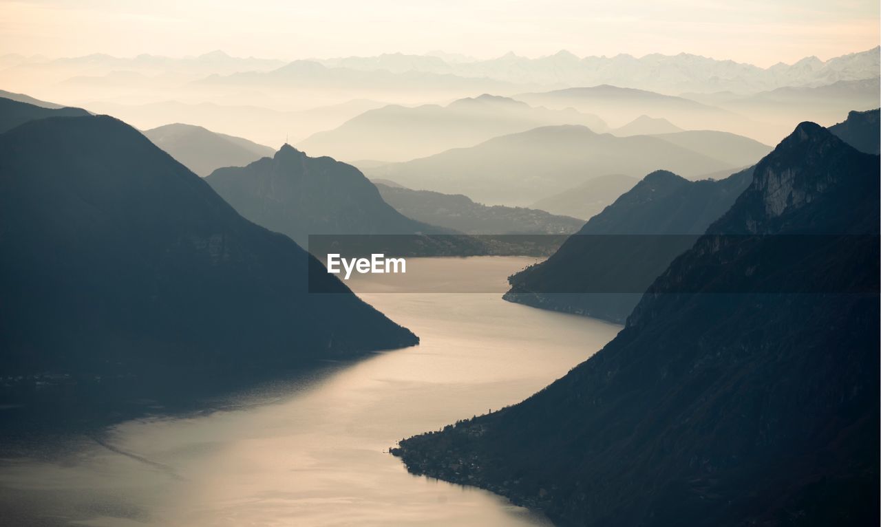 Scenic view of mountains against sky during sunset