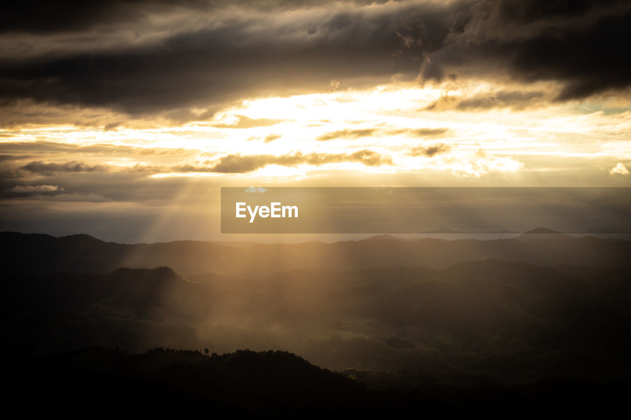 SILHOUETTE MOUNTAINS AGAINST SKY DURING SUNSET