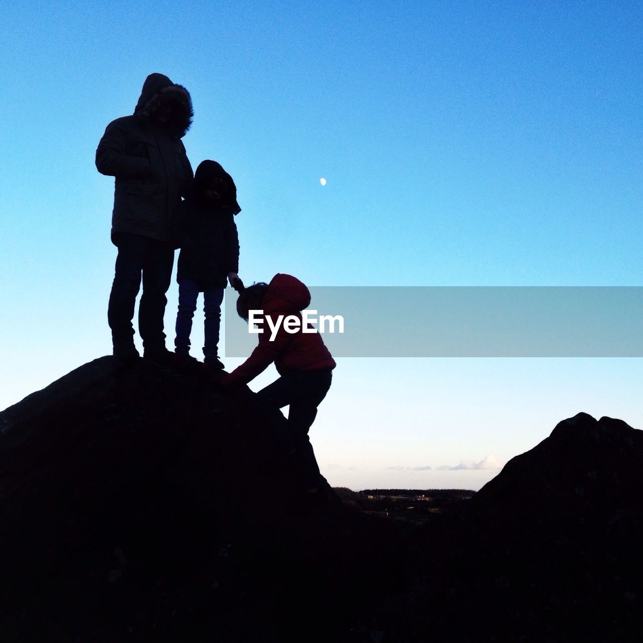 Child climbing rock