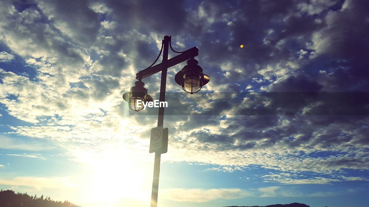 LOW ANGLE VIEW OF SKY DURING SUNSET AGAINST CLOUDS