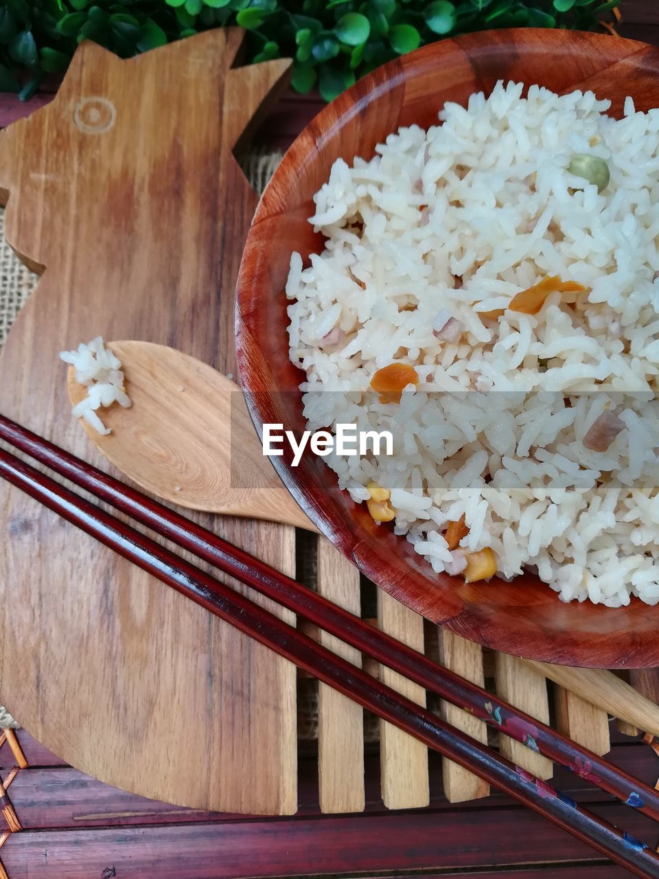 High angle view of rice in wooden bowl on table