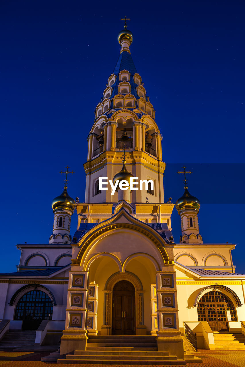 Low angle view of church against sky at night